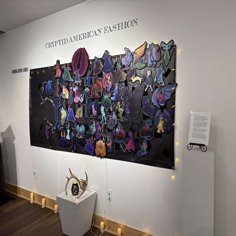 a photo of an exhibit on the wall with dark colors